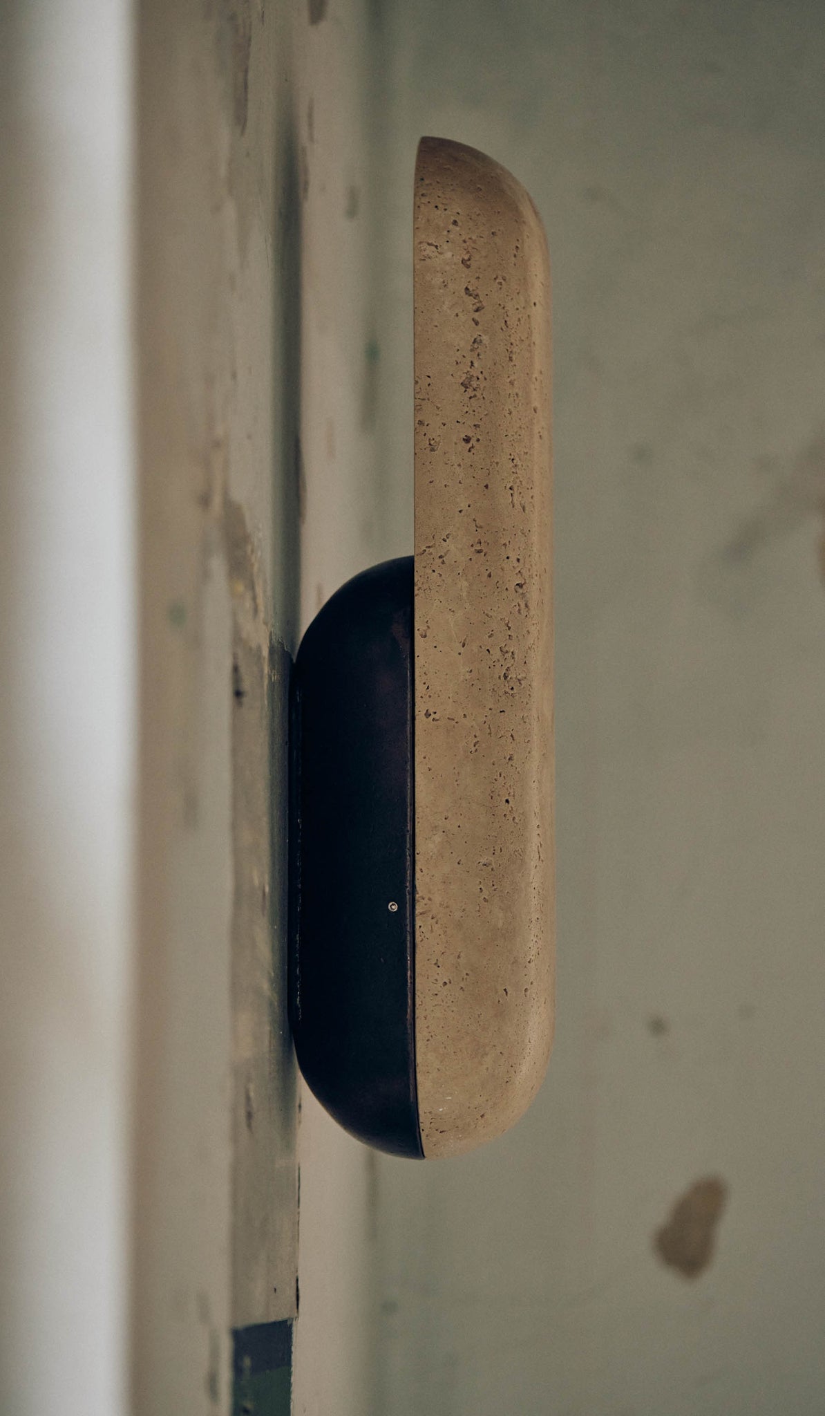 Studio Henry Wilson Classico Travertine with Blackened Cast Bronze Pill Sconce