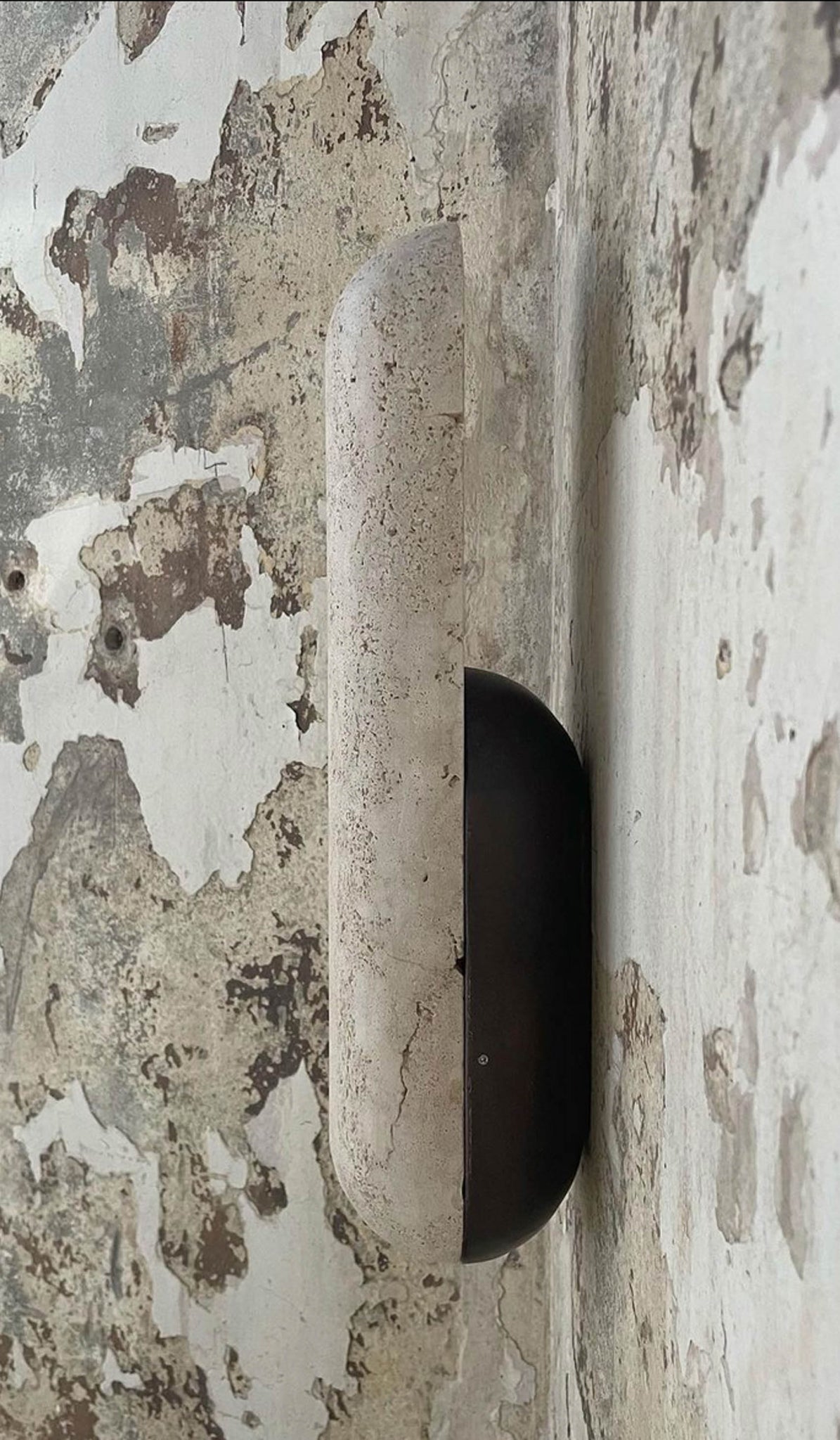 Studio Henry Wilson Classico Travertine with Blackened Cast Bronze Pill Sconce